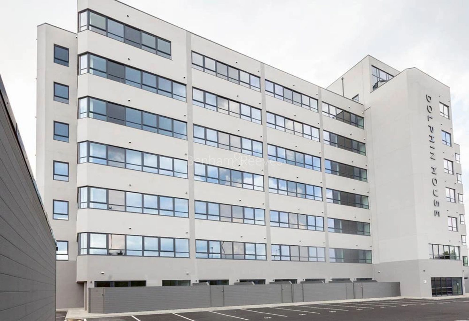 A completed white multi-storey building